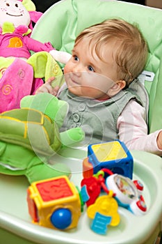 Baby girl playing with toys