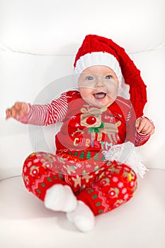 Baby girl posing in santa costume