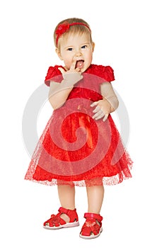 Baby Girl in Red Dress. Happy Kid in Fashion Holiday Clothes Suck Finger in Mouth. Child White Isolated