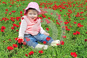 Baby Girl Sitting in Flowery Field