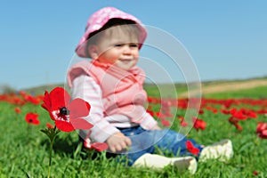Baby Girl Sitting in Flowery Field