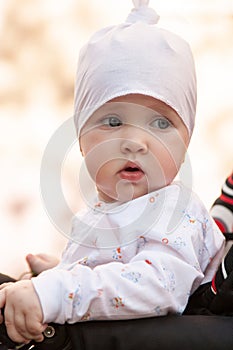 Baby girl sitting in a perambulator