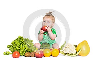Baby girl sitting surrounded by fruits and vegetables, isolated on white