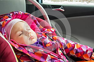 Baby girl sleeping in car