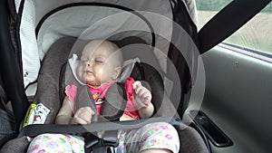 Baby Girl Sleeping in Child Car Seat.