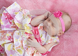 Baby Girl Sleeping in Floral Dress
