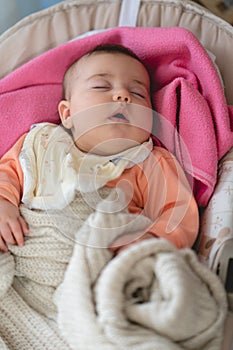 Baby Girl Sleeping in a Rocking Cradle