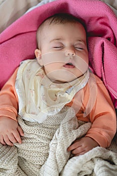 Baby Girl Sleeping in a Rocking Cradle