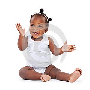 Baby, girl and smile with infant, excited and cheerful isolated against a white studio background. Female child, kid on