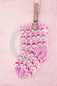 Baby girl socks on pink background