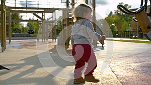 Baby girl is staggering after riding a carousel