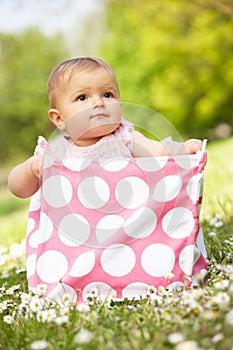 Baby Girl In Summer Dress Sitting In Bag