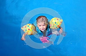 Baby girl in swimming pool