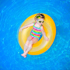 Baby girl in swimming pool