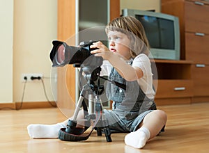 Baby girl takes photo with camera