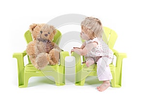 Baby Girl Talks with Her Toy Bear