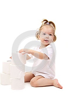 Baby girl with toilet paper