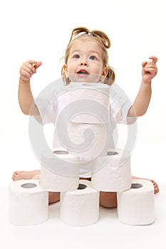 Baby girl with toilet paper