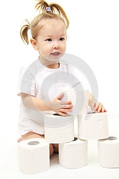 Baby girl with toilet paper