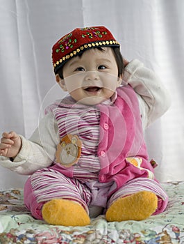 Baby girl in Uigur dress photo