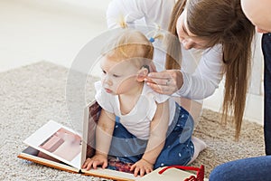 Baby girl wearing a hearing aid. Disabled child, disability and deafness concept.