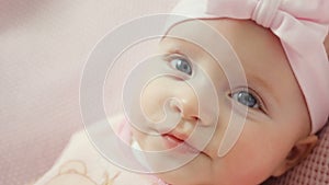 Baby girl in white dress and headband