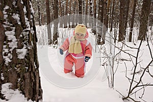 Baby girl in the winter forest