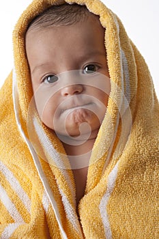 Baby Girl Wrapped In A Towel With An Odd Expressi