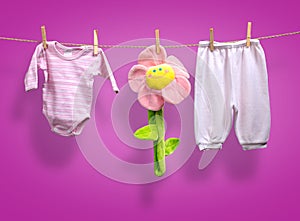 Baby girl y clothes on the clothesline