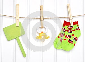 Baby Goods and Blank Sign on a Clothesline