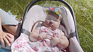 Baby in the grass close-up.