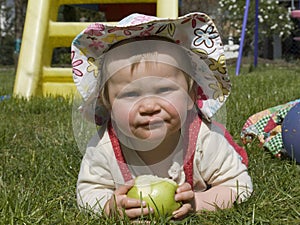 Baby with green apple