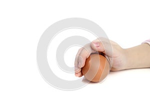 Baby hand with hen egg isolated