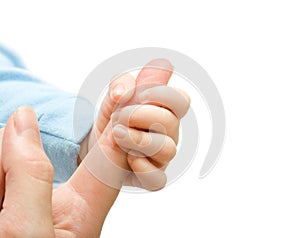 Baby hand holding mother finger