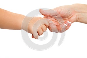 Baby hand holding mothers finger.