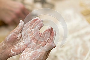 Baby hands in flour