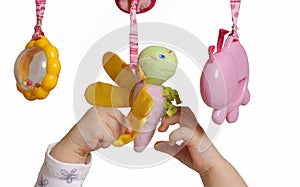 Baby hands with toys
