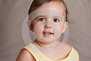 Baby, happy and portrait on face, child development and infant growth with learning, sitting and home. Girl, smile and