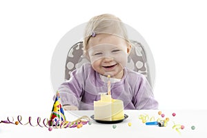 Baby having her first birthday, isolated on white