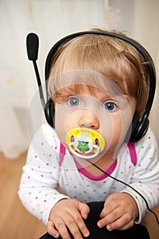 Baby with headset pacifier