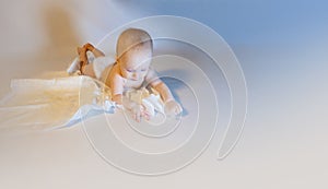 a baby with a hemangioma on his neck lies on a white background photo