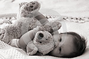 Baby hugging teddybear