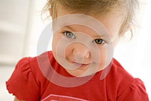 Baby indoors smiling