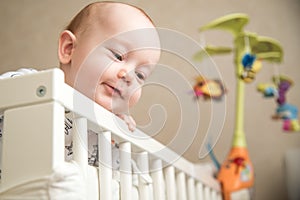 Baby infant boy in his bed