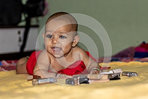 Baby infant cute innocent smiling facial expression with blurred background