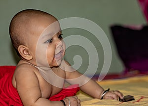 Baby infant cute innocent smiling facial expression with blurred background