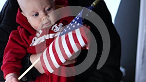 baby infant holding and touching American usa flag Independence Day concept