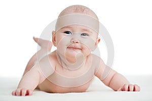 Baby isolated lying smilingly photo