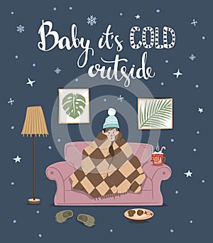 Baby its cold outside handwritten quote, cute humor winter card with person sitting on couch under blanket
