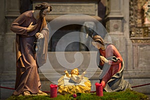 Baby Jesus in Cradle with Mary and Joseph statues